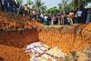 CD_Mourners watch caskets in mass grave_3 2025_0026750