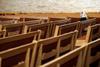 2020-12-28T153559Z_2017590297_MT1USATODAY15367760_RTRMADP_3_A-LONE-PARISHIONER-SITS-IN-THE-PEWS-DURING-GOOD-FRIDAY-MASS