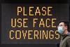 Please use face coverings sign