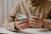 Male hands holding a phone