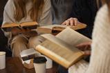 side-view-people-holding-books