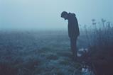 Solitary Figure in Frosty Landscape