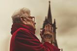 Contemplative Elderly Woman in Prayer