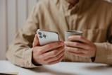 Male hands holding a phone