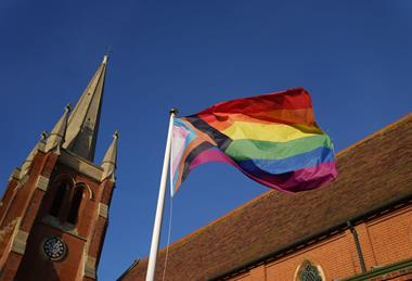 Pride flag outside a church