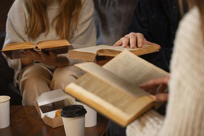 side-view-people-holding-books