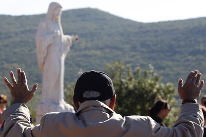 2010-10-08T120000Z_6823520_GM1E6A90CCZ01_RTRMADP_3_MEDUGORJE-VIRGIN