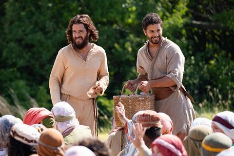 S3 still - Feeding the 5,000 - Jesus and Simon the Zealot feed the hungry crowd