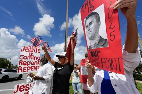 2025-09-13T185801Z_1057536941_MT1USATODAY27073152_RTRMADP_3_COMMUNITY-MEMBERS-GATHER-AT-THE-INTERSECTION-OF-STATE-ROAD
