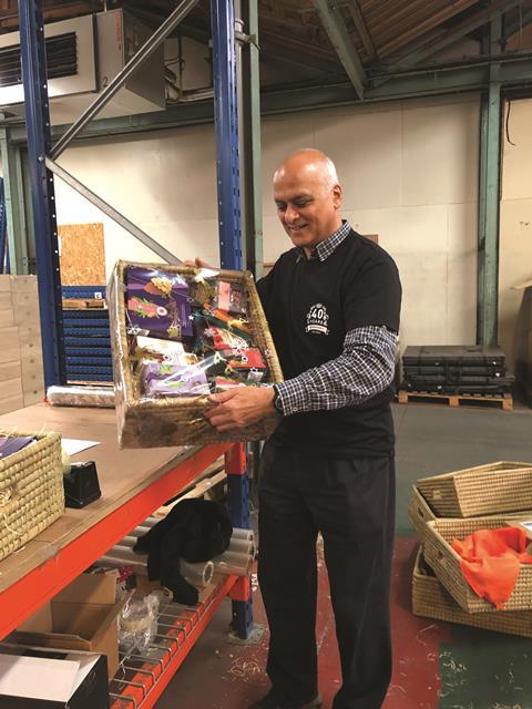 photo Ram BETTER helping pack goods as a volunteer at Traidcraft