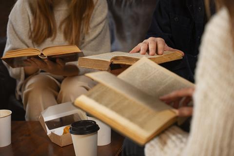 side-view-people-holding-books