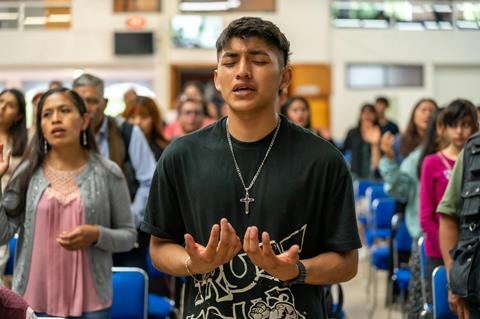 Young man worshipping