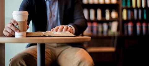 man-in-cafe-with-bible