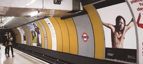 Artwork of Jesus on the cross by Johan Andersson, part of a Stations of the Cross series of adverts on the London Underground