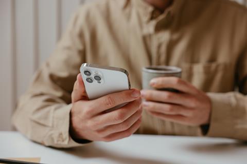 Male hands holding a phone