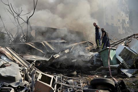 Civil defence members work at a site damaged in the aftermath of Israeli strikes on Beirut's southern suburbs, amid the ongoing hostilities between Hezbollah and Israeli forces, Lebanon, November 1, 2024.